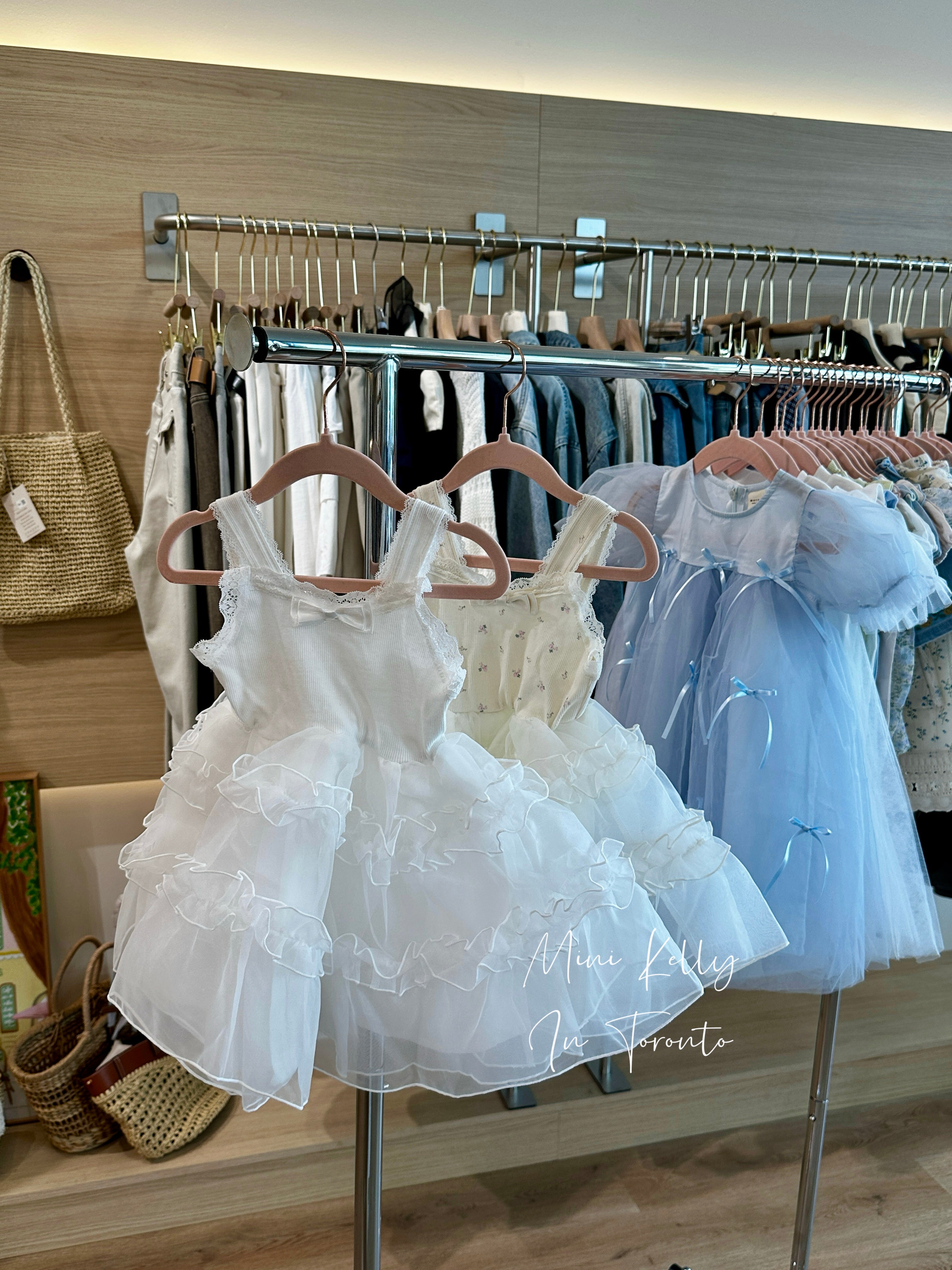 Mini Kelly white ruffle dress on rack